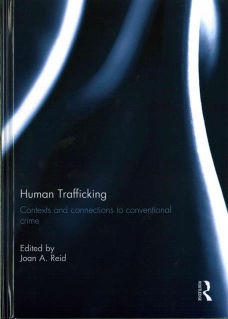 Book cover of: Human Trafficking. By: Joan Reid