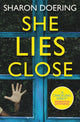 Book cover of: She Lies Close. By: Sharon Doering
