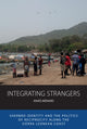 Book cover of: Integrating Strangers. By: MENARD